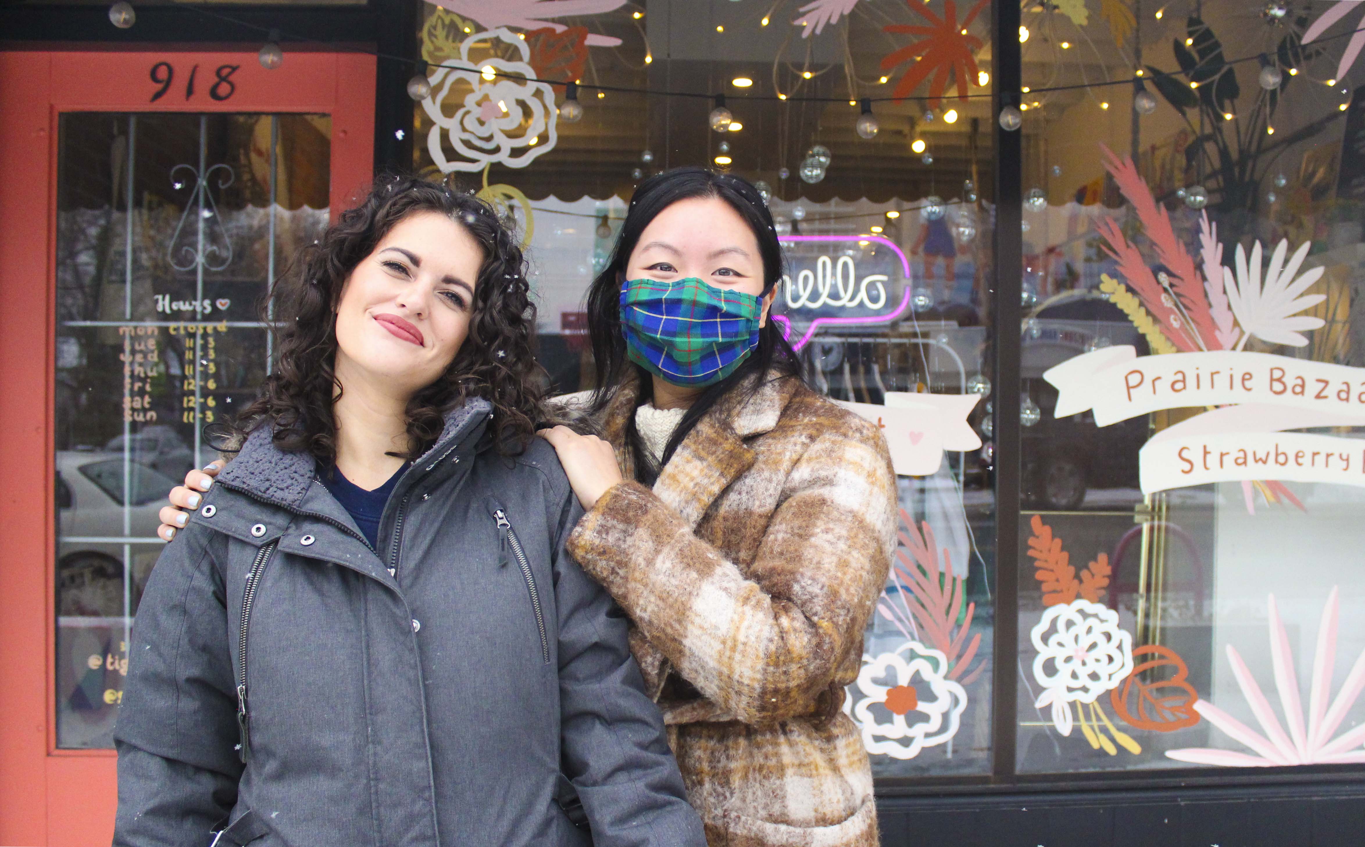 Lee Crawford-Vieira, left, and Alice Lam, right, pose for a photo in front of their store, Tigerstedt Flea Market in Calgary on Friday, Oct. 23, 2020. On top of running their own businesses, both are involved in the community work in Calgary such as clothing drives and food drives. (Photo by Kelly Fotog/The Press)